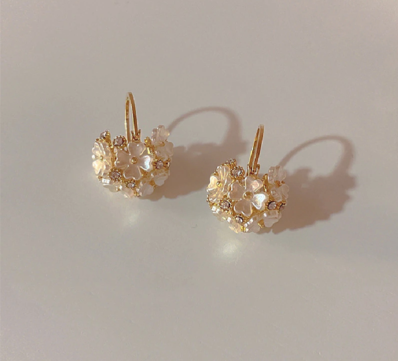 Prashina Earrings. 18K gold plated with rhinestones shaped as a flower bouquet.